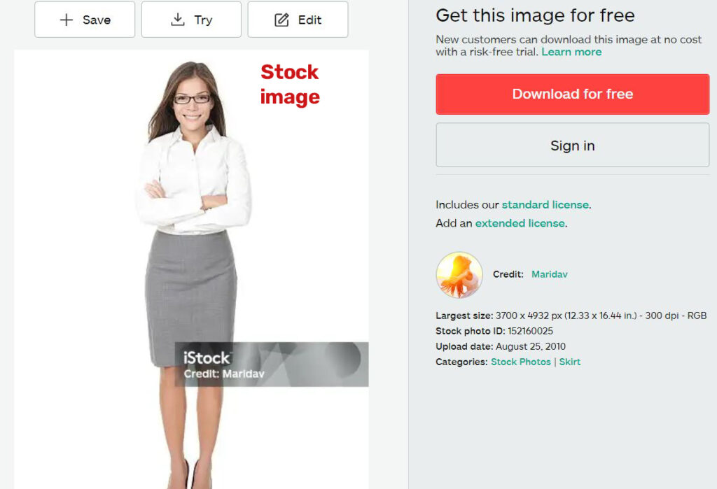 woman in work clothes standing istock